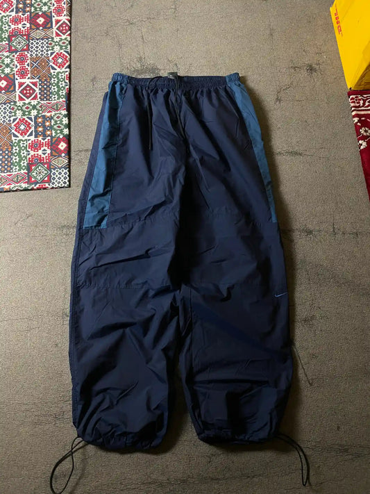 NIKE BAGGY TRACK TROUSERS